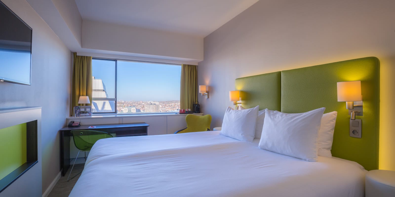 Bed in double room with view over centre of Brussels