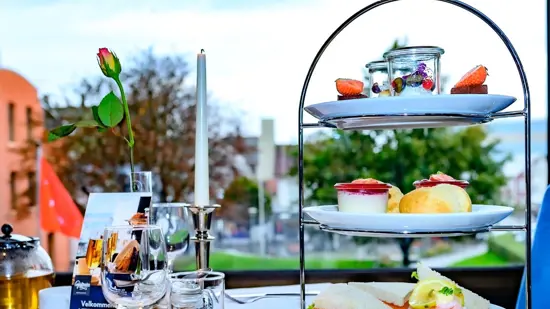 Picture of a table set with tea and baked goods
