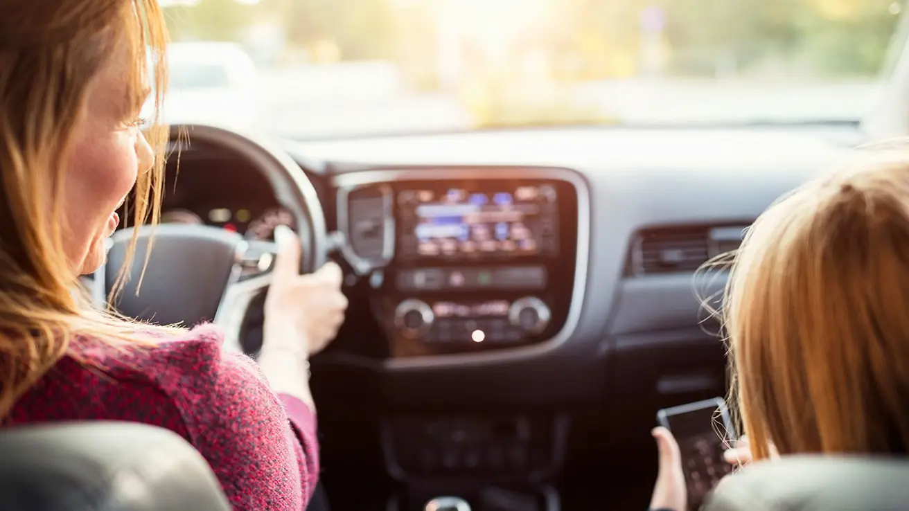 Woman and child in an electric car