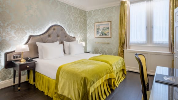 Room at Stanhope Hotel Brussels with large bed and sitting area