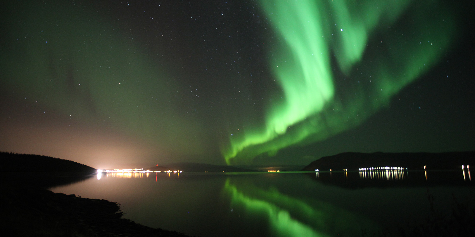 Alta with dancing northern lights above it.