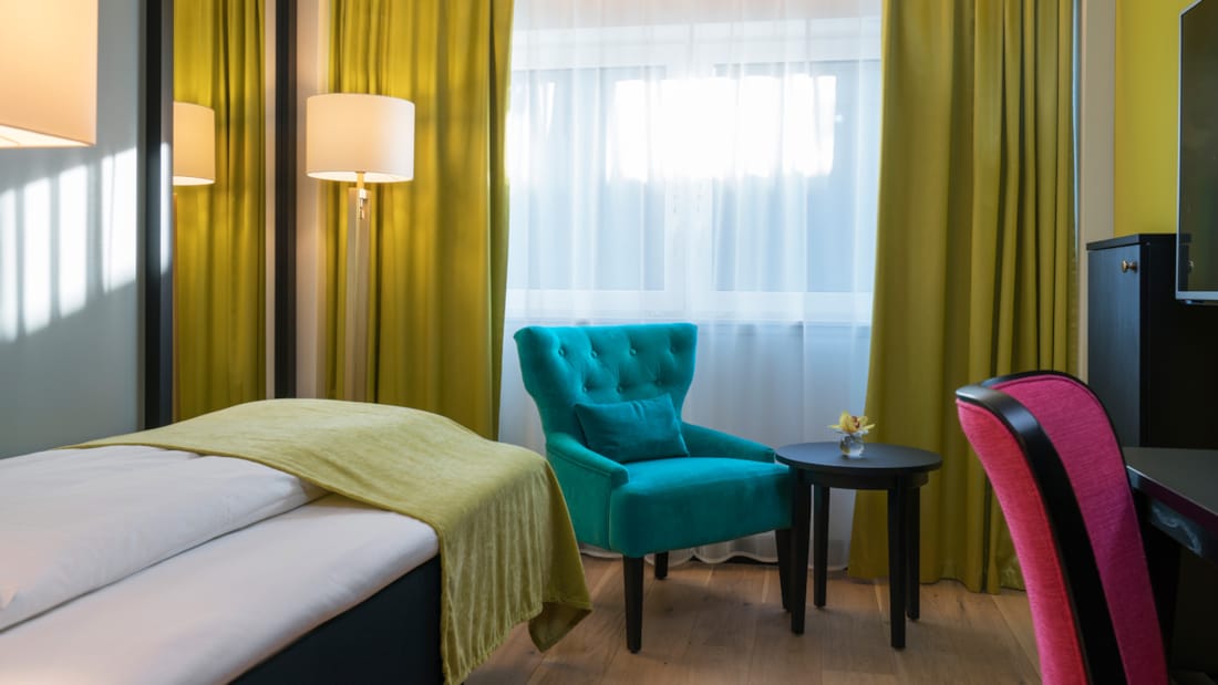 Bed in eenpersoonskamer in Thon Hotel Arendal