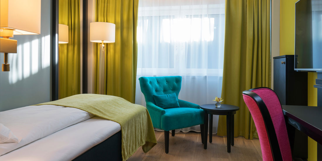 Bed in eenpersoonskamer in Thon Hotel Arendal