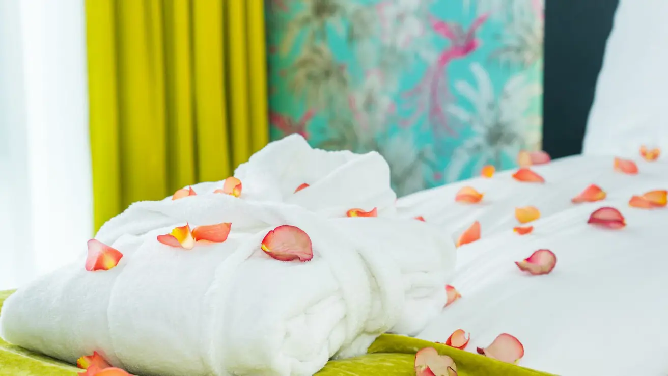 Folded bathrobe with rose petals