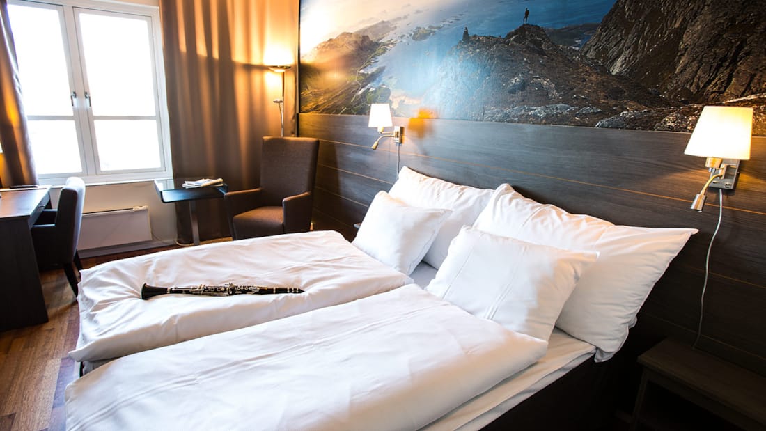 bed in superior room at skagen hotel in bodø