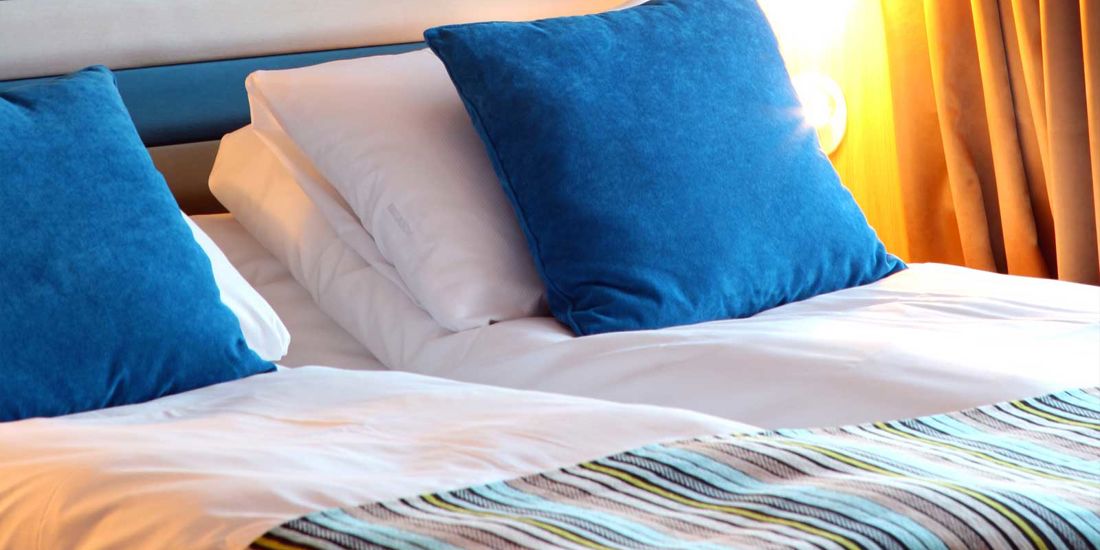The bed in a Superior room at Thon Hotel Brønnøysund