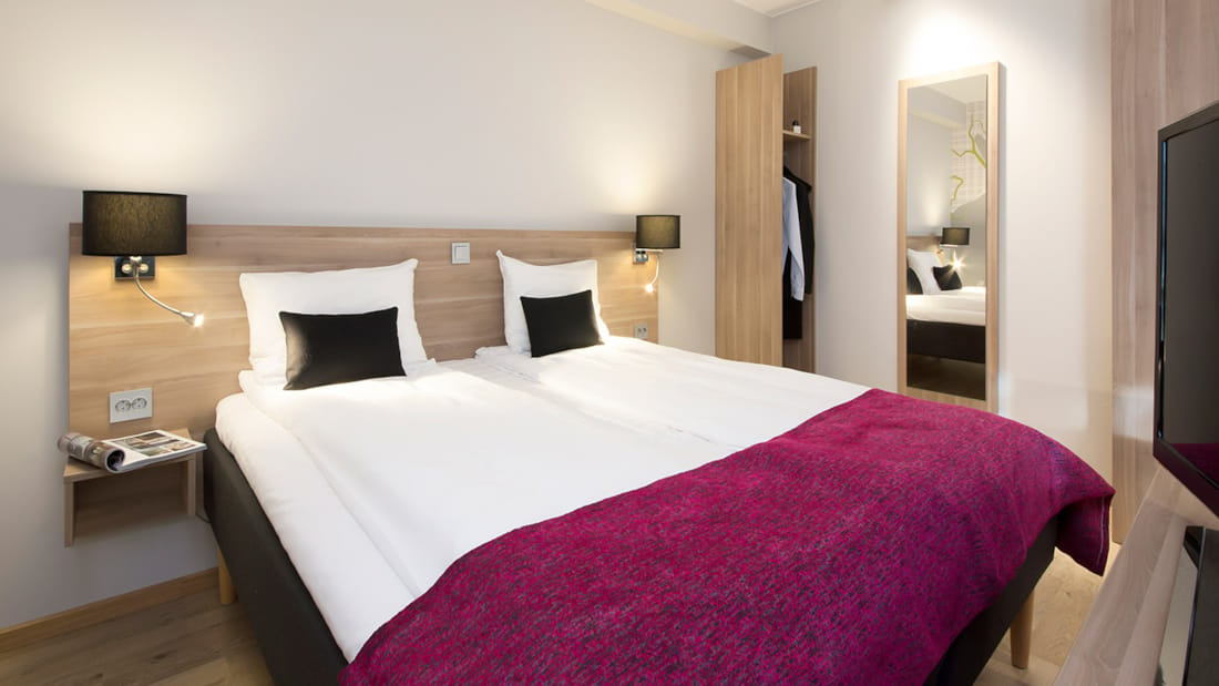 Double bed in superior room at Elgstua Hotel in Elverum