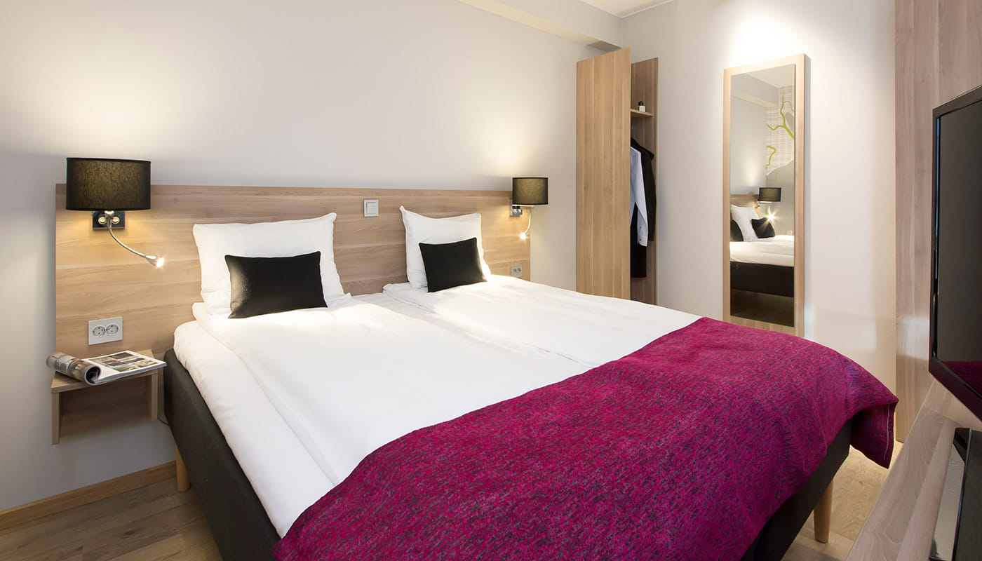 Double bed in superior room at Elgstua Hotel in Elverum