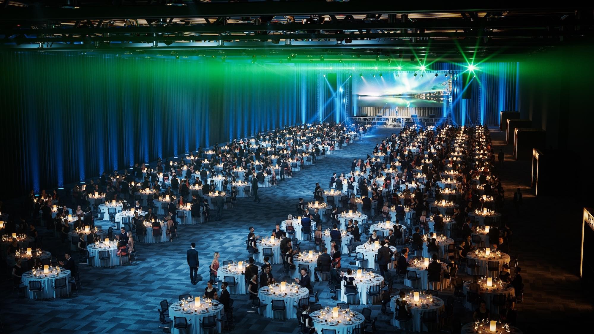 Konferencesal på Thon Congress Gardermoen i banketopsætning, men rød lyssætning.