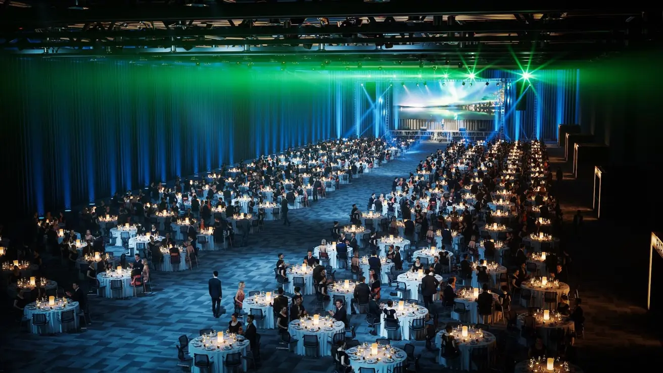 Conference room at Thon Congress Gardermoen with banquet layout and red lighting.