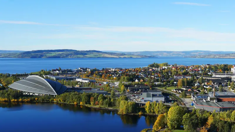 Drone image of Hamar. Vikingskipet and Mjøsa on the left. City centre on the right.