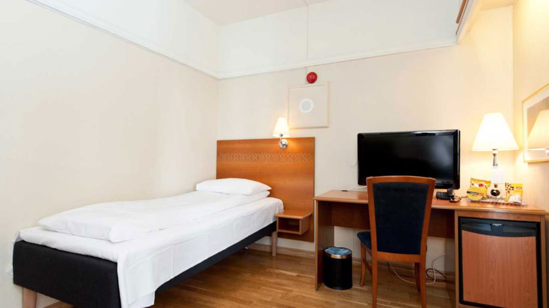 Bed in eenpersoonskamer in Thon Hotel Saga in Haugesund