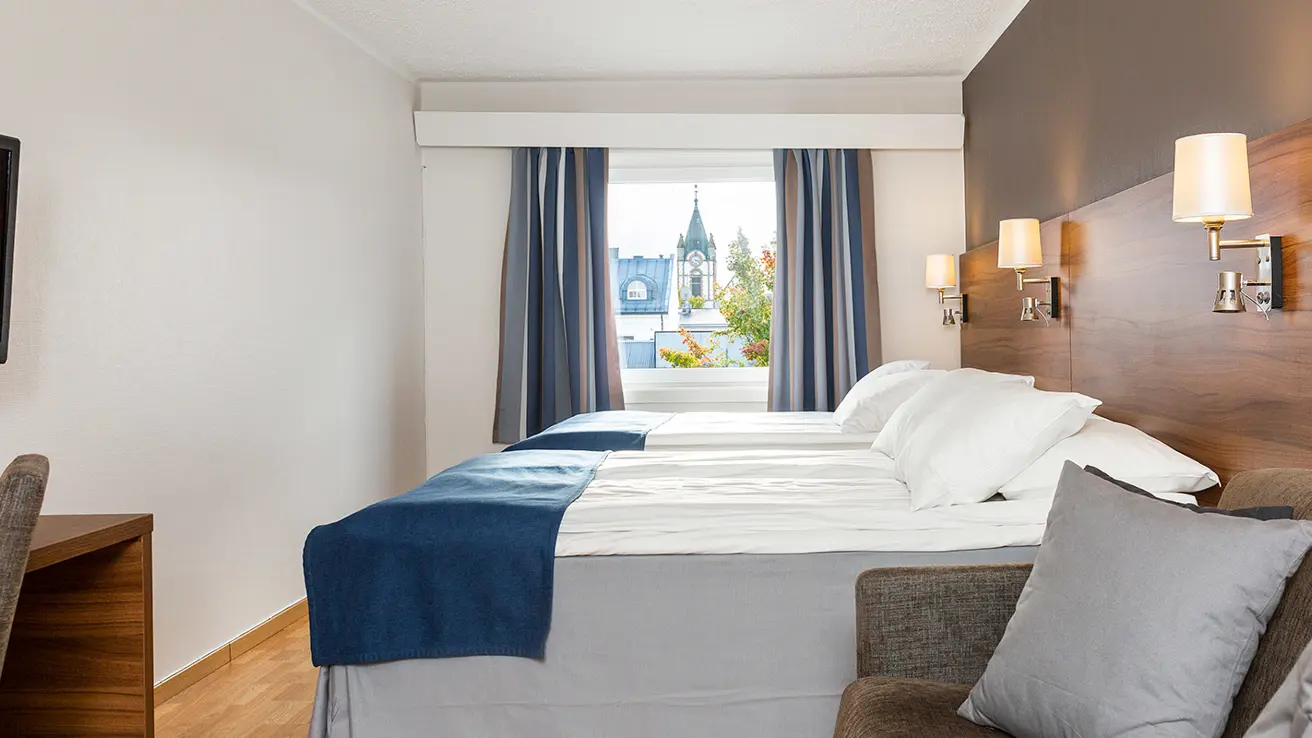The bed in a Family room at Thon Hotel Backlund in Levanger