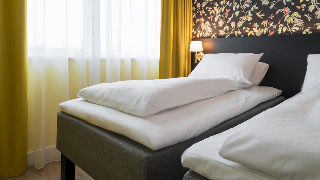 Bett im Twin-Zimmer im Thon Hotel Triaden in Lørenskog