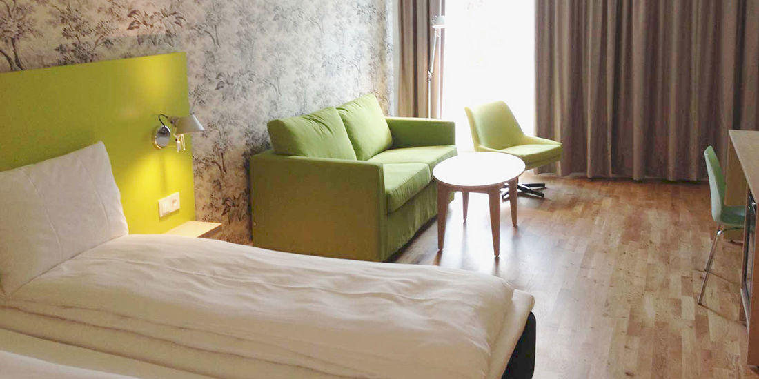 The bed in a Family room at Thon Hotel Sandven in Norheimsund