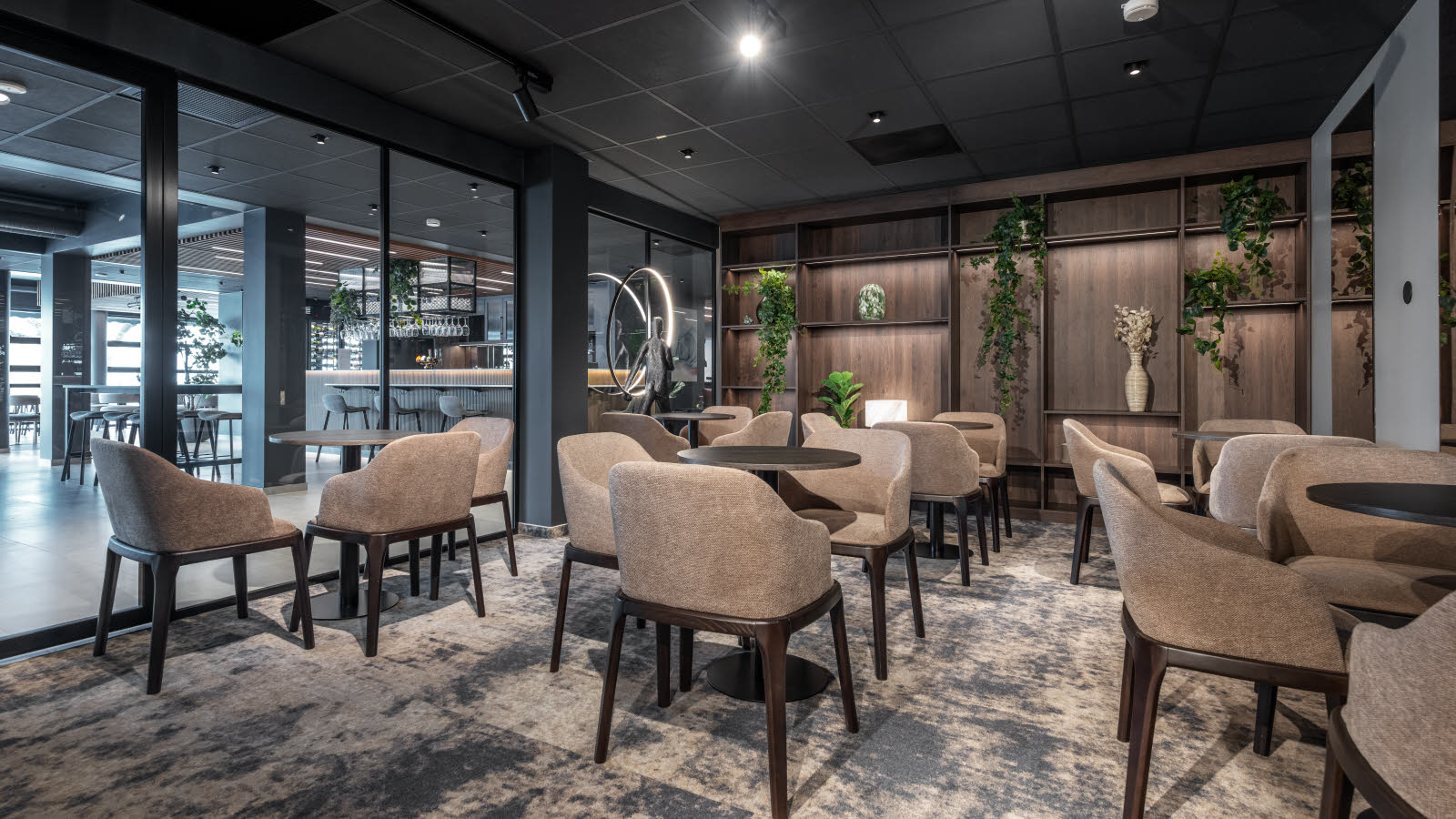 Meeting room in the lobby area with banquet layout.