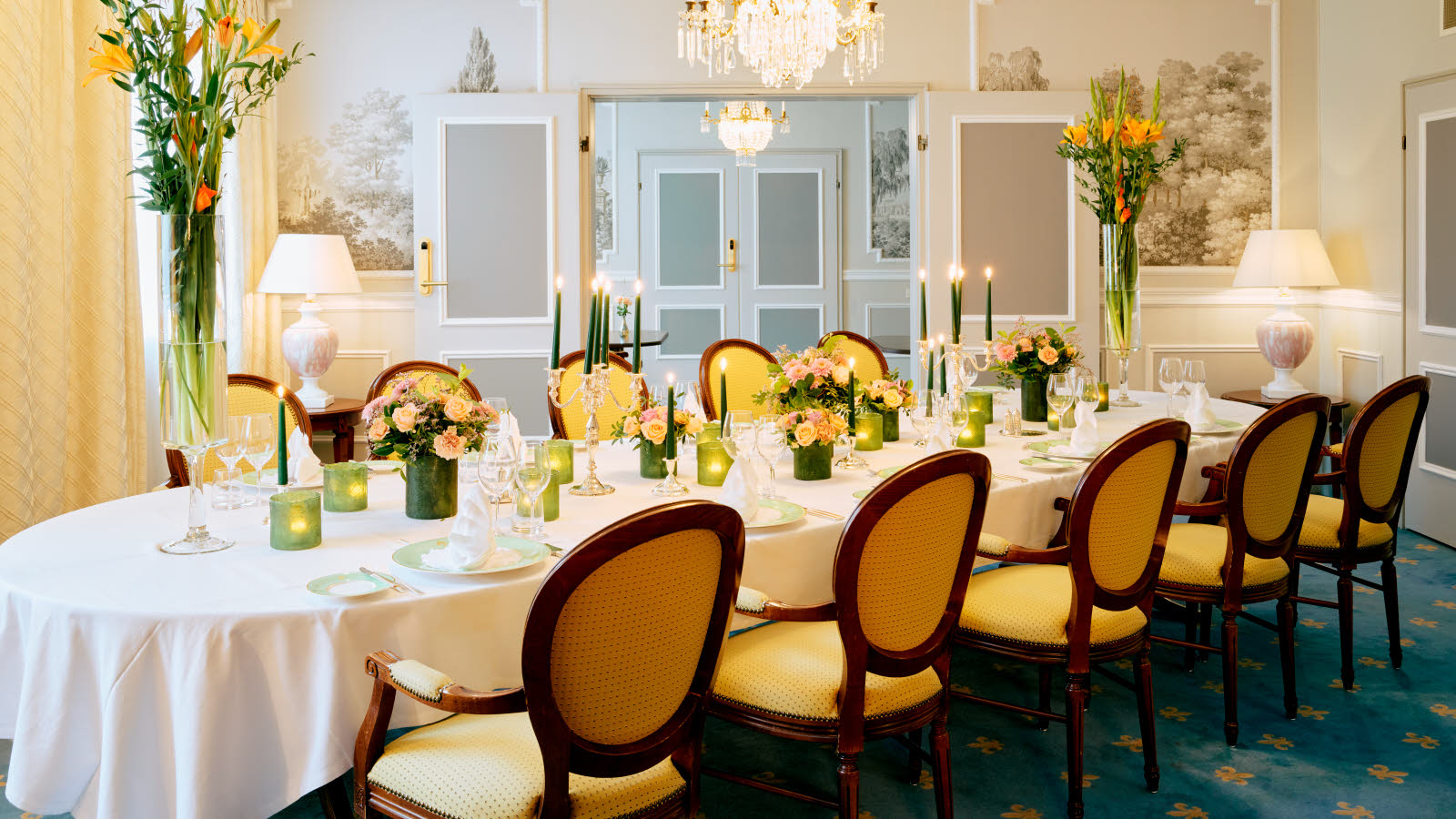 Social room with round table and chandelier