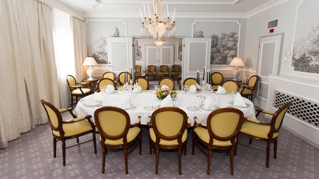 Social room with round table and chandelier