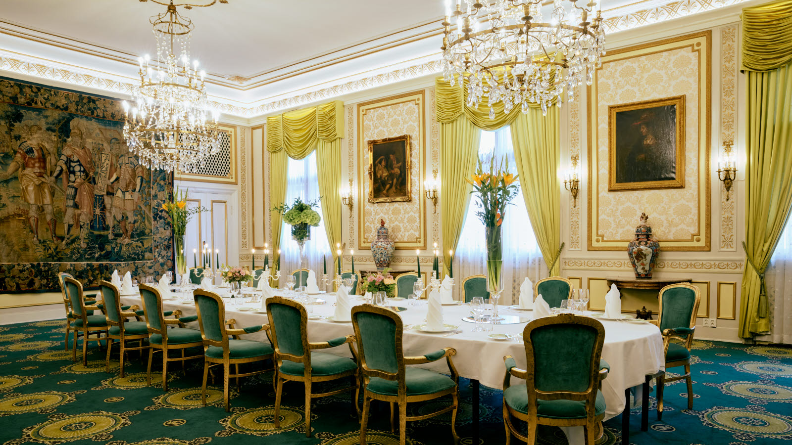 Hall in banquet layout with several chandeliers
