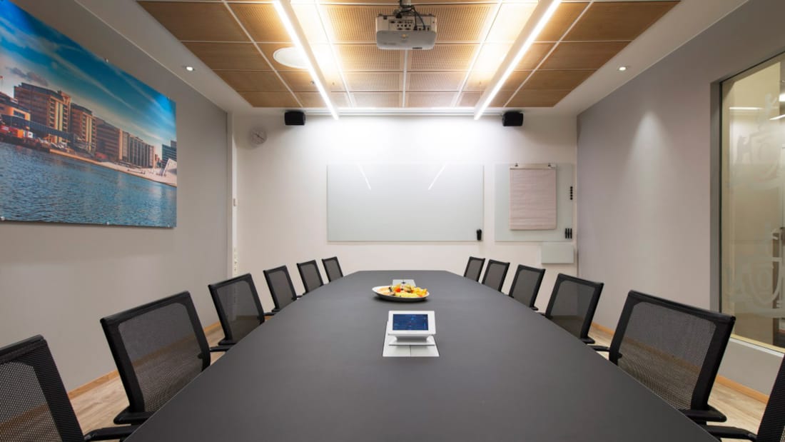 Meeting room with long table and projector