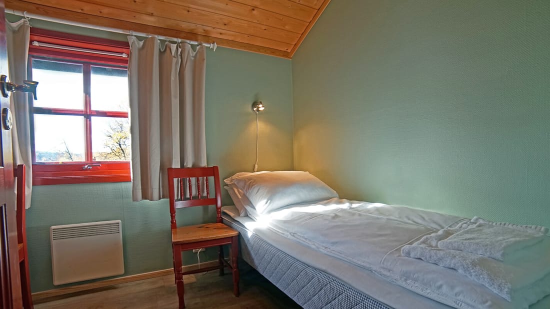 Bed in kleine slaapkamer in appartement in het Thon Hotel Skeikampen