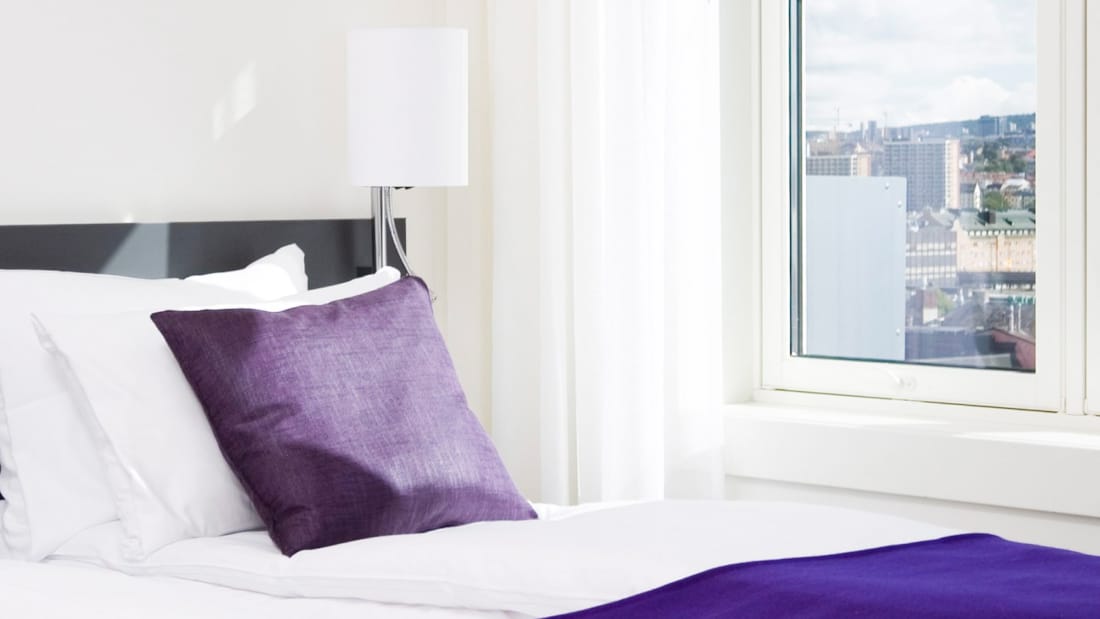 Säng i superiorlägenhet på Oslo Panorama Apartments