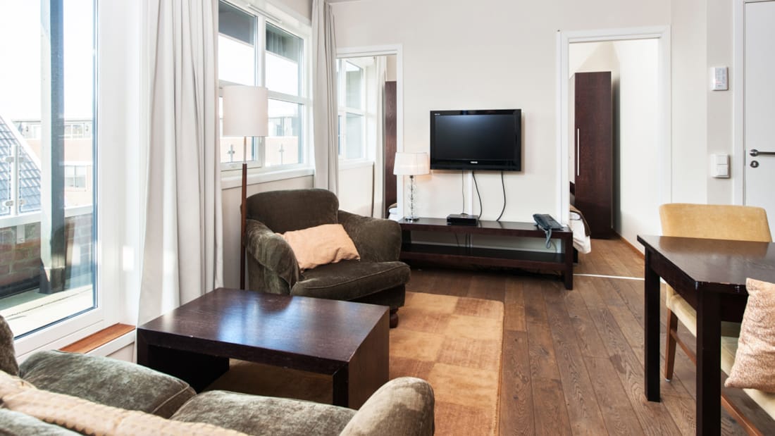 The living room in a two-bedroom apartment at Thon Hotel Sandnes