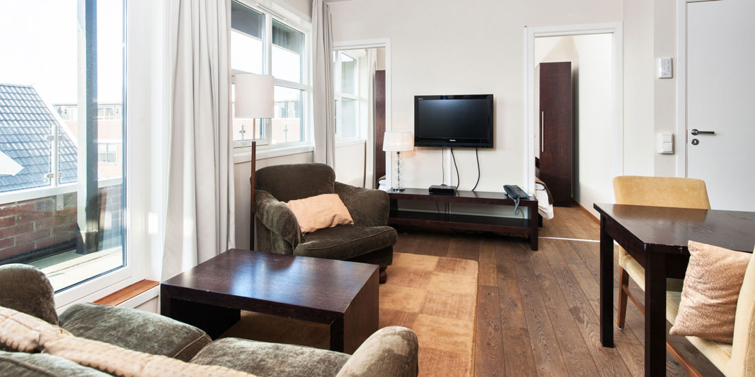 The living room in a two-bedroom apartment at Thon Hotel Sandnes