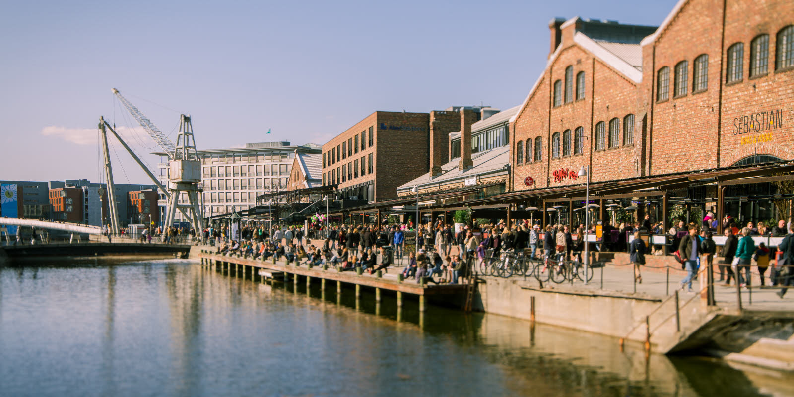 Solsiden in Trondheim with restaurants along the river.