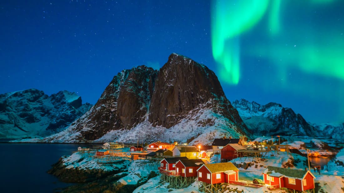Northern Lights above the mountains in Lofoten