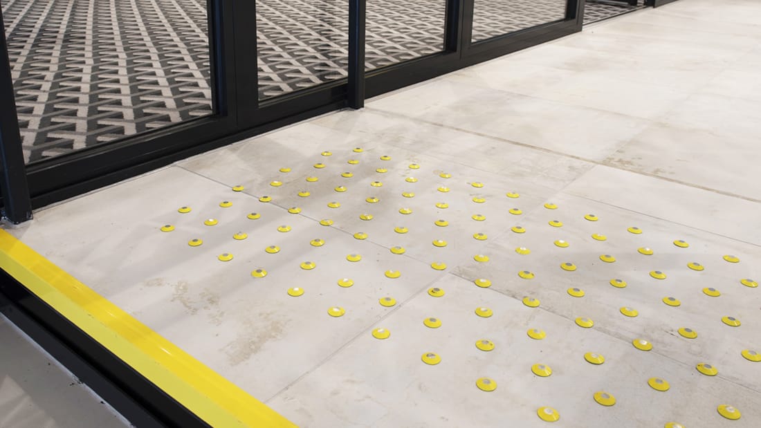 Steps with yellow strips designed for people who are visually impaired