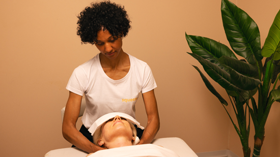 Lady massaging customer