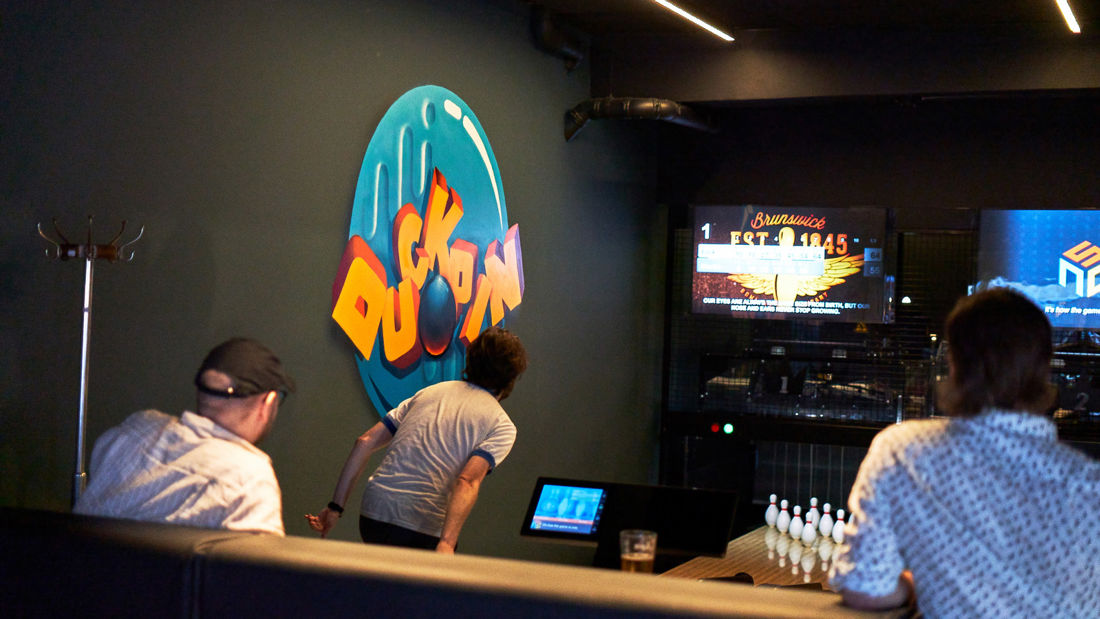 Group of young men playing duckpin