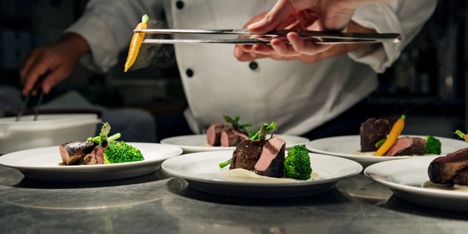 Chef lays out food ready for serving