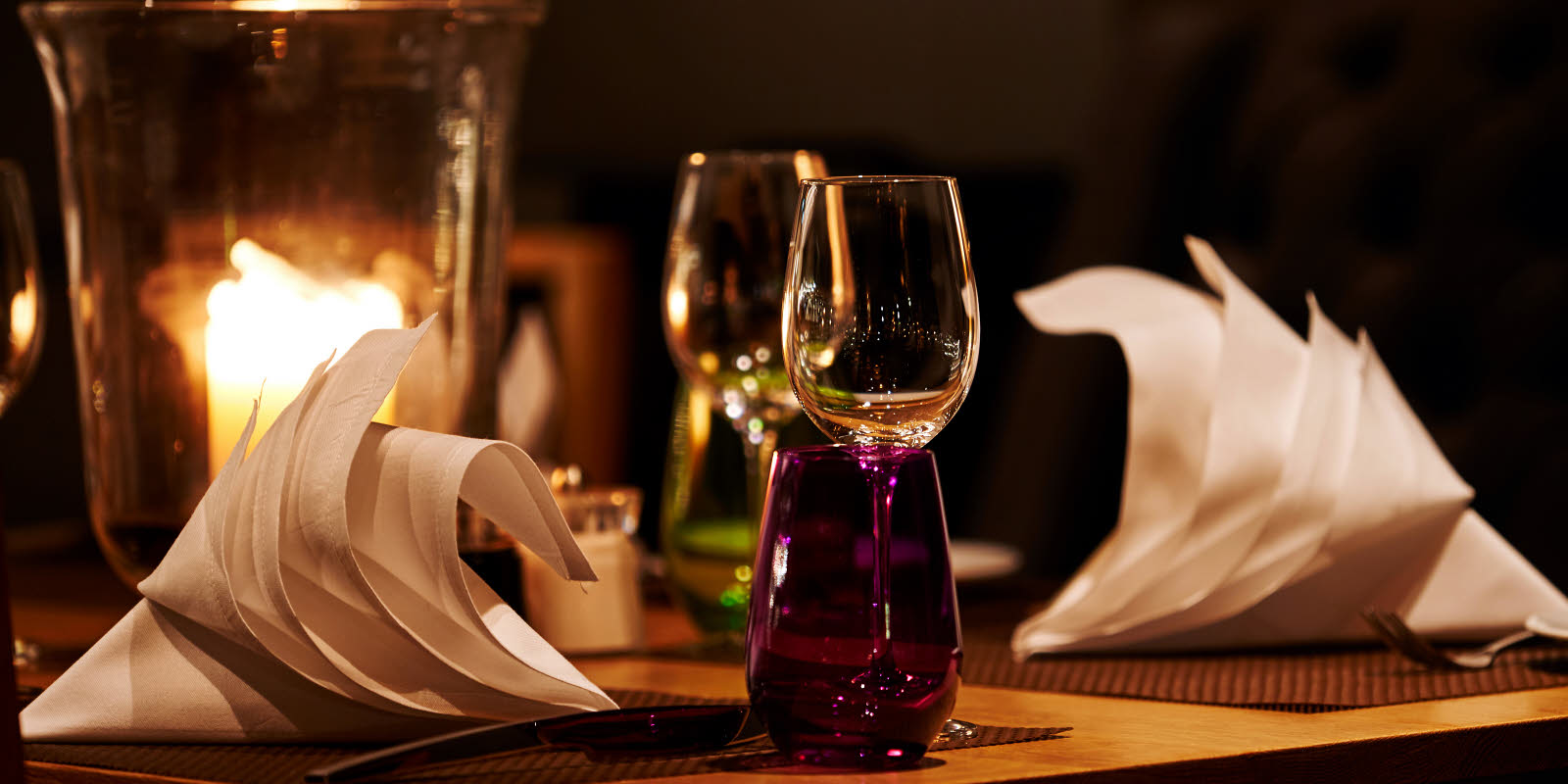 Wine glasses and set table for dinner for two