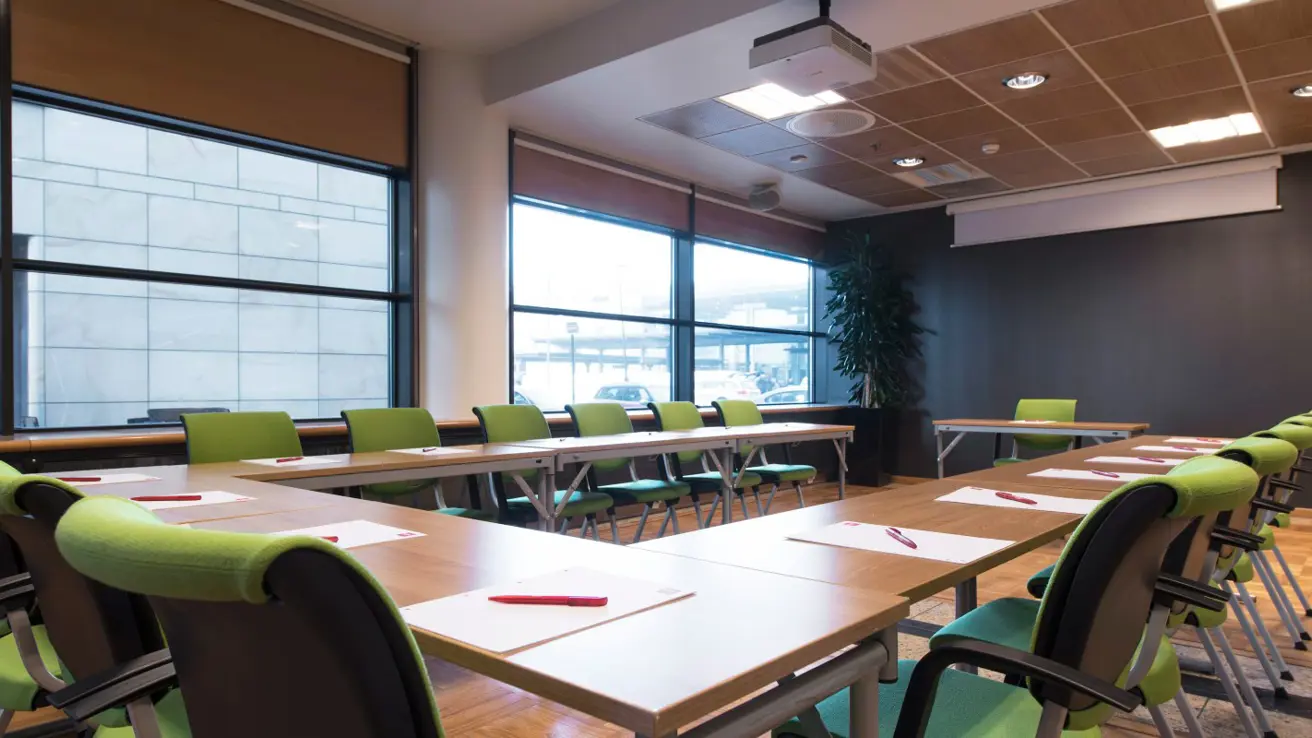 Meeting room with u-shaped table layout